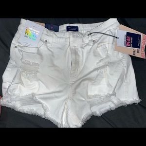 White ripped jean shorts.